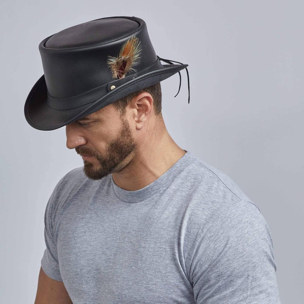 A man wearing Marlow Black Finished Top Hat with LT Band Crown on a side view