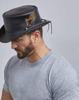 A man wearing Marlow Black Finished Top Hat with LT Band Crown on a side view