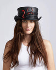 A woman wearing Lil Evil Black Leather Top Hat