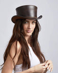 A woman wearing Unbanded Marlow Brown Finished Top Hat facing front