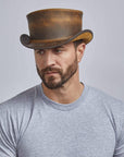 A man wearing Unbanded Burnt Honey Marlow Top Hat
