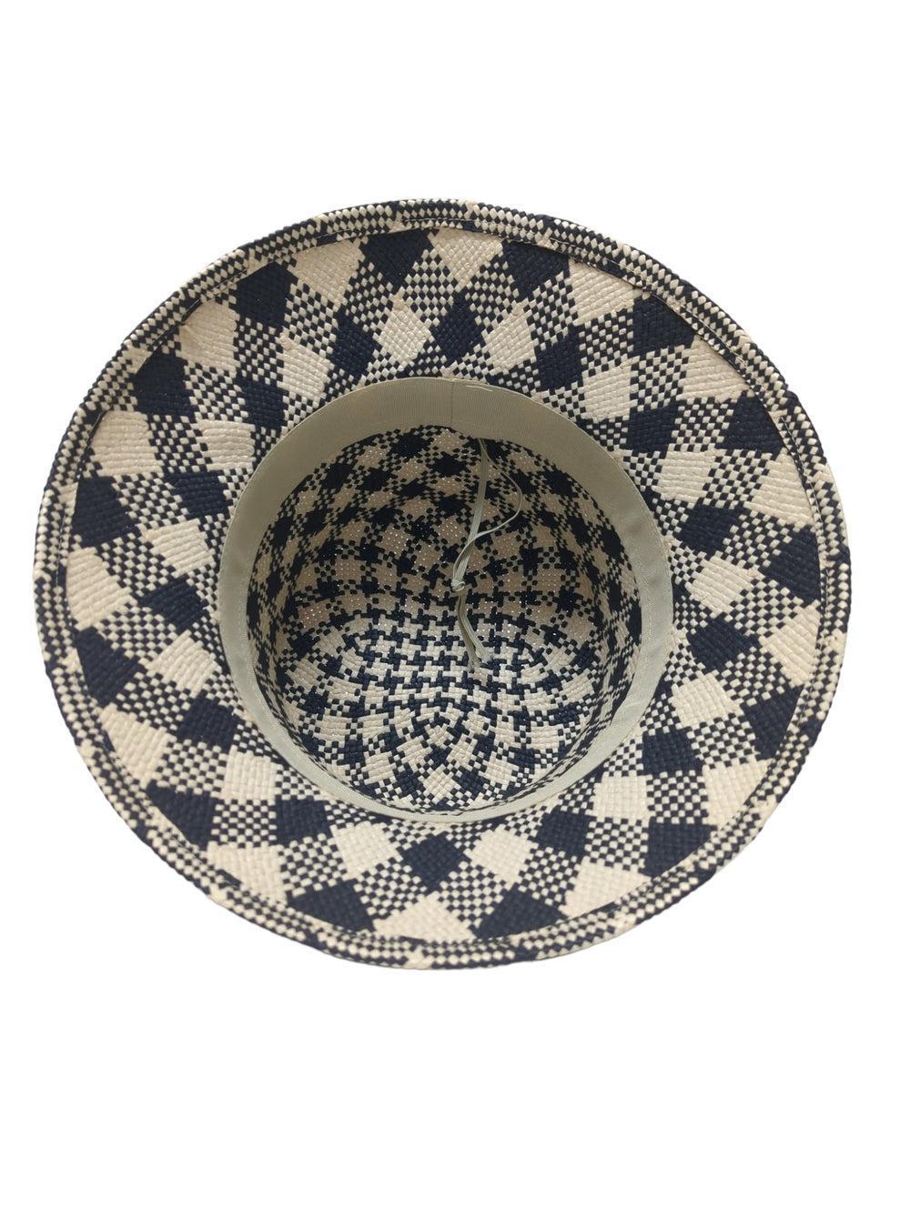 An bottom view of a black and natural straw bucket hat