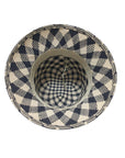 An bottom view of a black and natural straw bucket hat