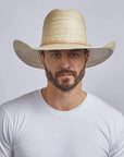 A man looking straight wearing Ringo Natural Vaquero Tejano Palm Cowboy Hat 