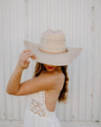 A woman wearing Natural Vaquero Tejano Palm Cowboy Hat on a front view