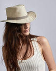 A woman wearing Rogan Hemp Khaki Fabric Sun Hat on a left angle view