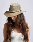 A woman wearing Seagrass Cubana Straw Sun Hat on an angle view