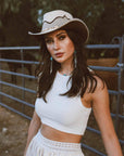 A woman in a white tops wearing Leather Mesh Cowboy 