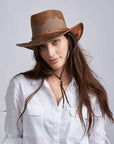 A woman wearing Sirocco Copper Mesh Leather Sun Hat 