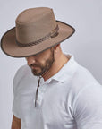 A man in white polo shirt wearing Soaker Brown Mesh Sun Hat 