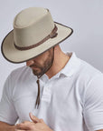 A man wearing a Soaker Eggshell Mesh Sun Hat on an angle view