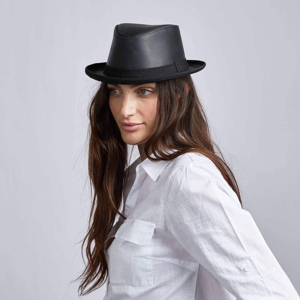A woman wearing Soho Black Cowhide Leather Fedora on an angle view