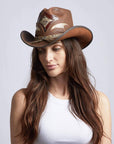 A woman in white tops wearing Storm Brown Leather Cowboy Hat with Rattlesnake Skin Band on an angle view