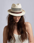 A woman wearing Tuscany Cream Straw Fedora Hat 