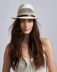 A woman wearing Tuscany Cream Straw Fedora Hat on a front view 