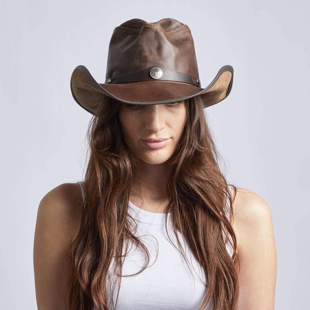 A woman wearing Chocolate Western Leather Cowboy Hat on a front view 