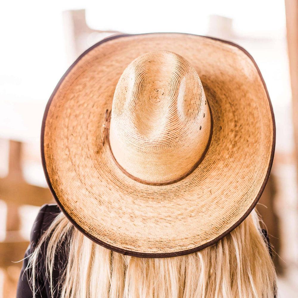  A back view of a Yuma Tan Straw Palm Cowboy Hat 