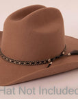 A side view of a Bodie Black Hat Band on a brown felt hat