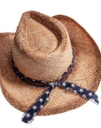 A top view of Dusty brown straw cowboy hat
