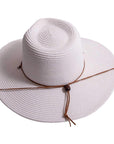 A top view of Felix white straw sun hat with chinstrap 