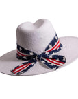 A front view of a Knox white straw sun hat with US flag designed hat band